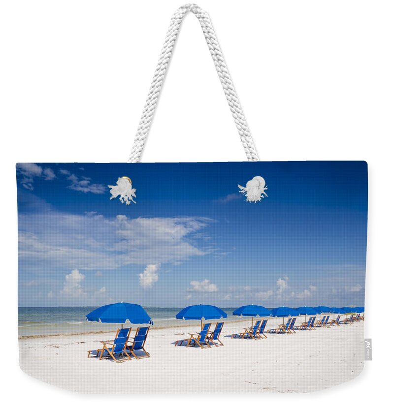 Beach Weekender Tote Bag featuring the photograph Blue Umbrellas by Sean Allen