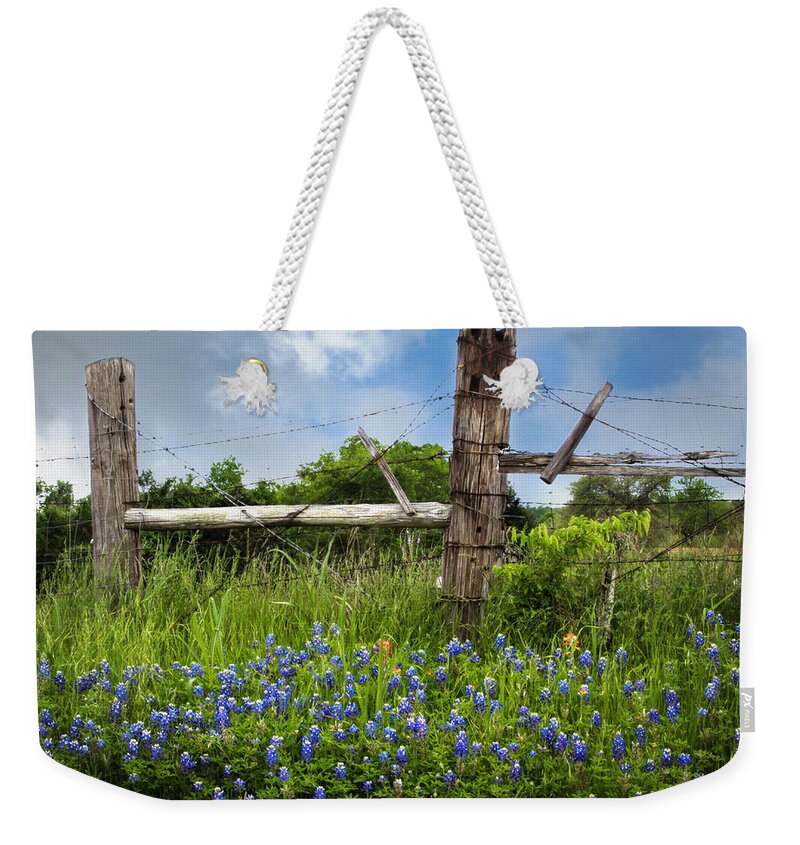 Bloom Weekender Tote Bag featuring the photograph Bluebonnets and Fence by David and Carol Kelly