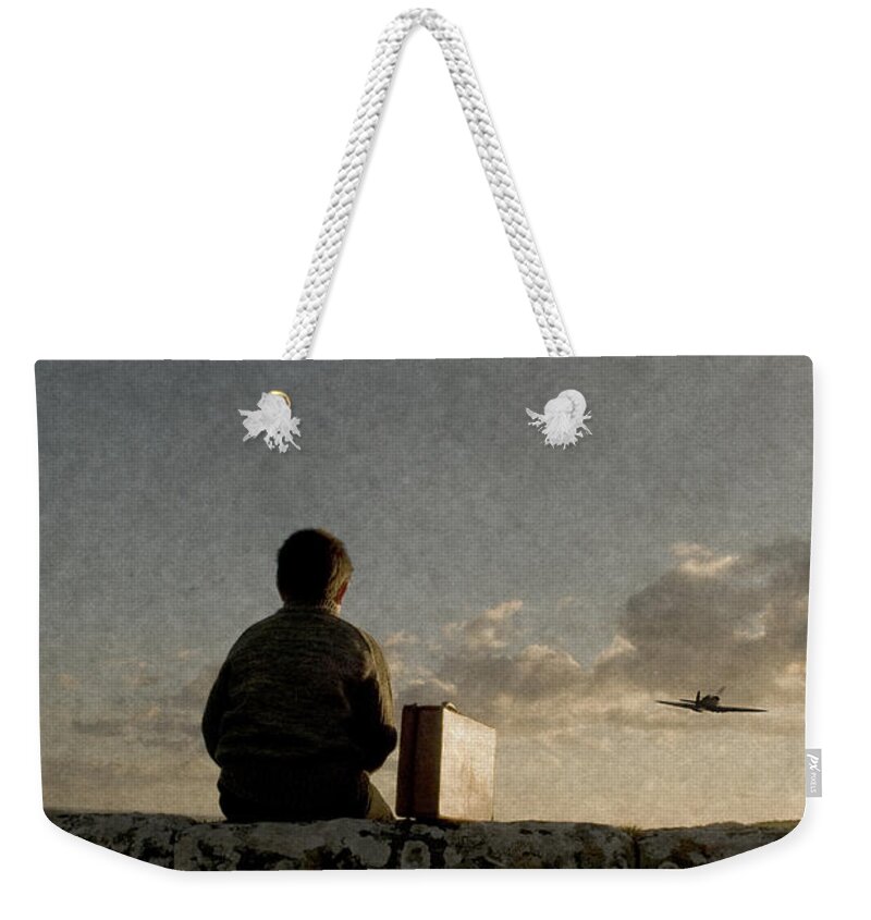 Boy Weekender Tote Bag featuring the photograph Boy on wall by Clayton Bastiani