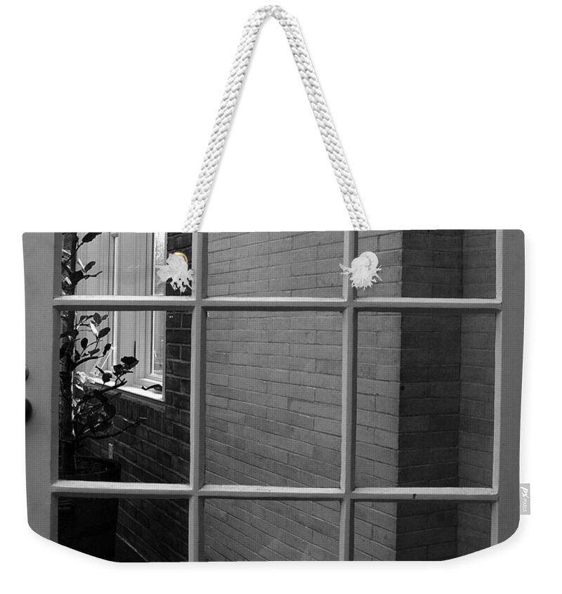 Door Weekender Tote Bag featuring the photograph Brick Wall Framed by Mary Courtney