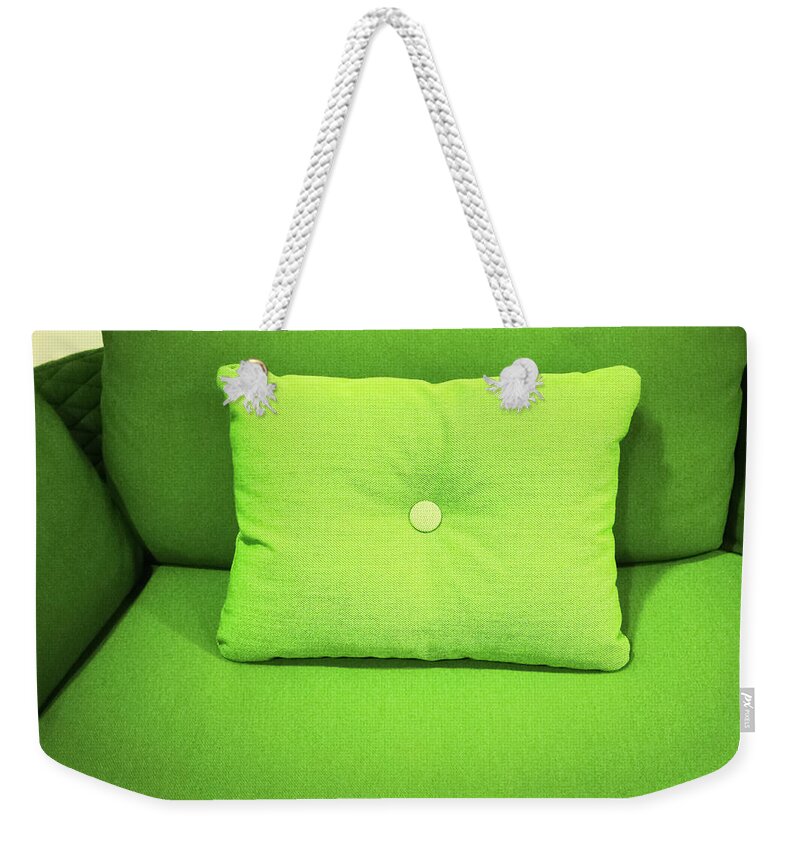 Sofa Weekender Tote Bag featuring the photograph Bright green sofa with cushion by GoodMood Art