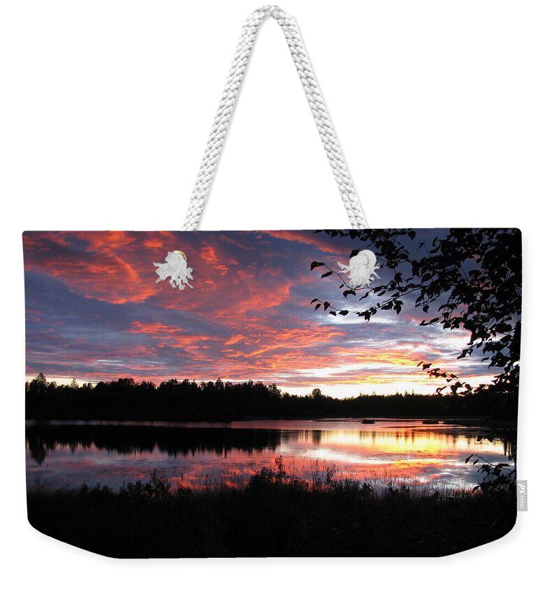 Sunset Weekender Tote Bag featuring the photograph Brilliant Sunset framed by tree by Anthony Trillo