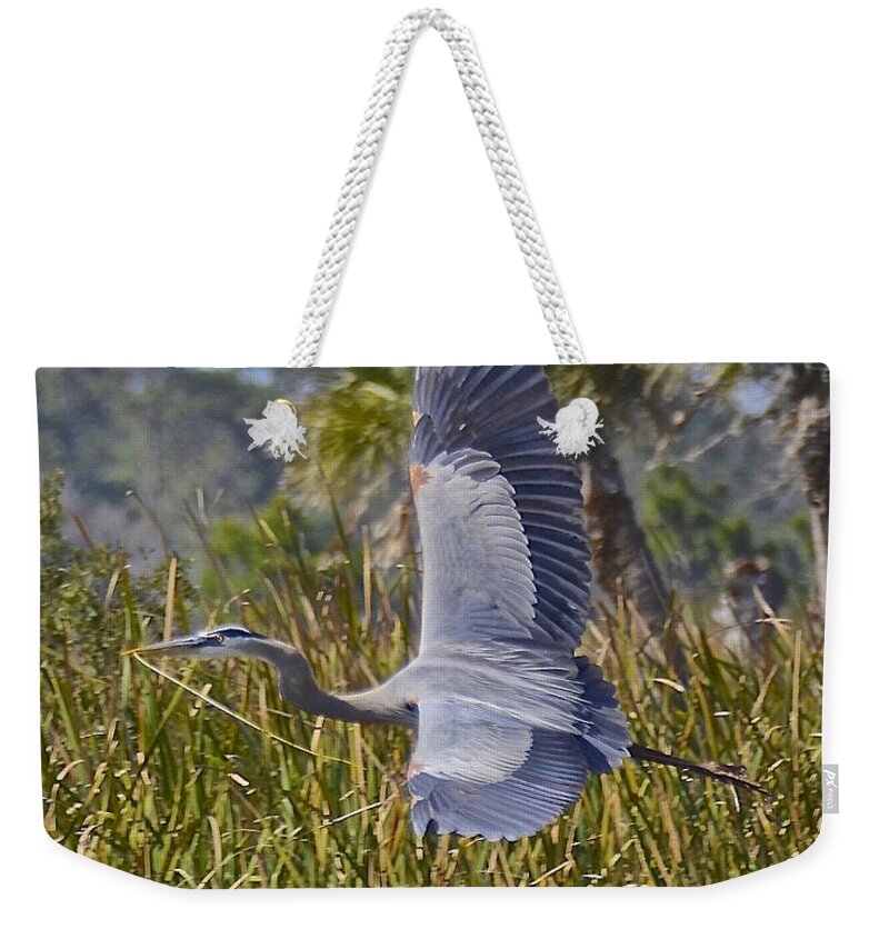 Heron Weekender Tote Bag featuring the photograph Bringing Home the Bacon by Carol Bradley