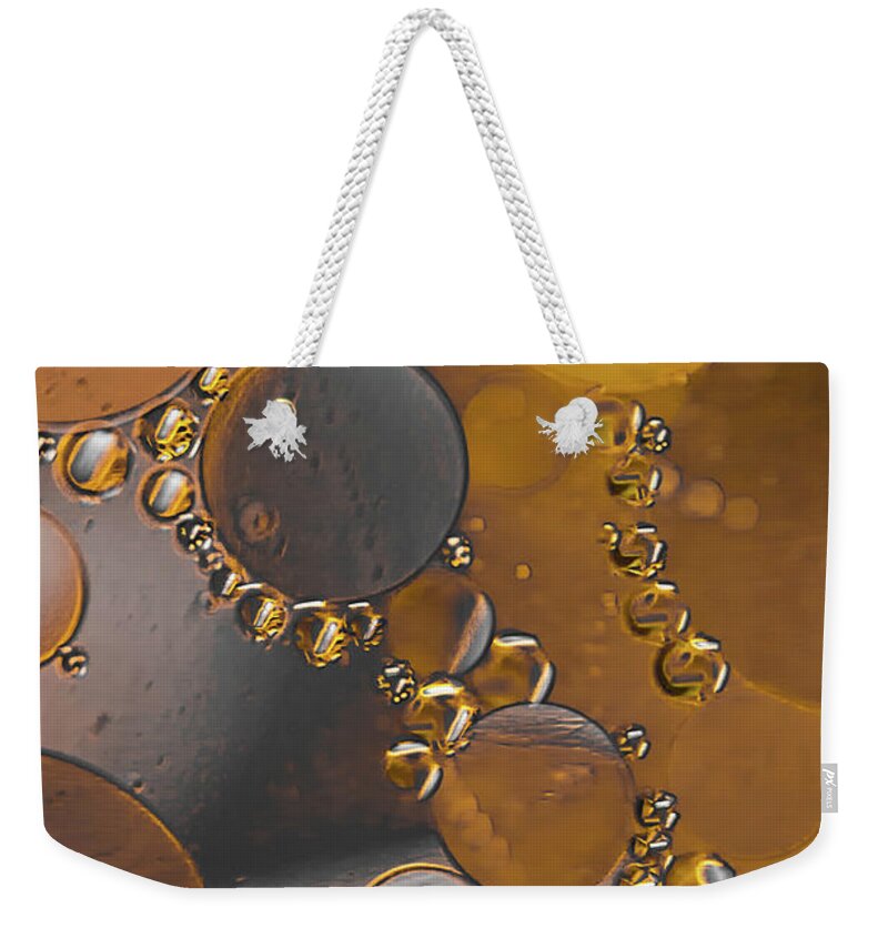 Oil Weekender Tote Bag featuring the photograph Bubble Motion Abstract by Bruce Pritchett