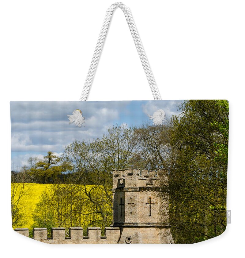 Stone Wall Weekender Tote Bag featuring the photograph Burghley House Fortifications by Shanna Hyatt