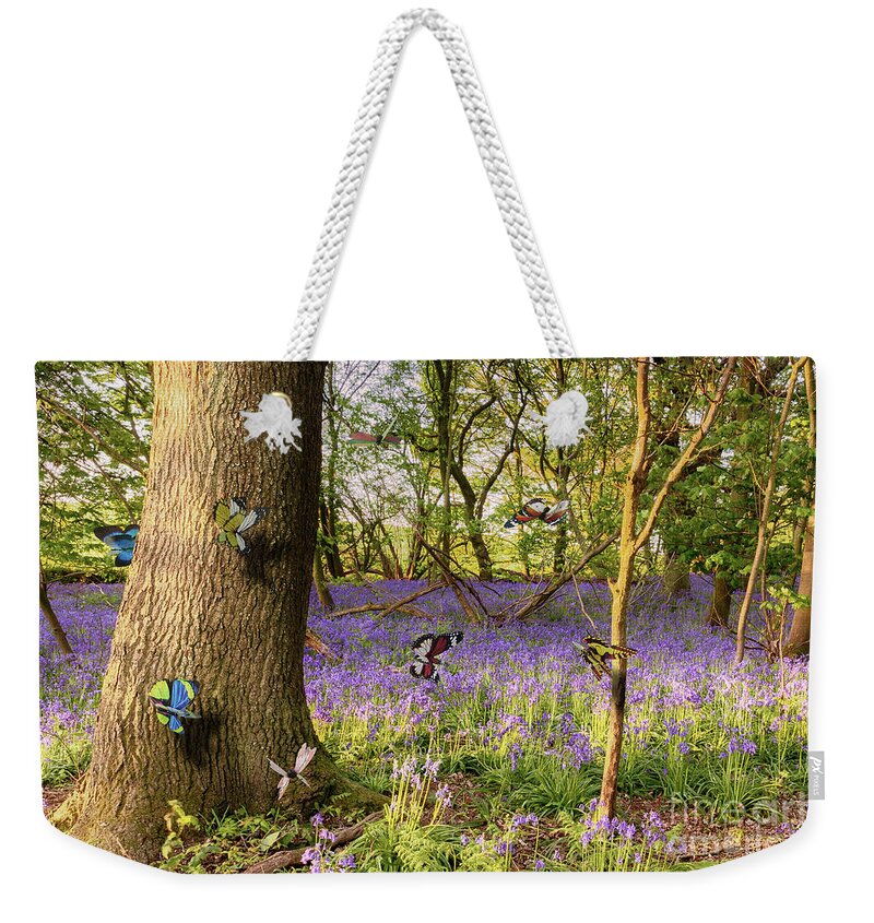 Butterflies Weekender Tote Bag featuring the photograph Butterflies in a bluebell woodland by Simon Bratt