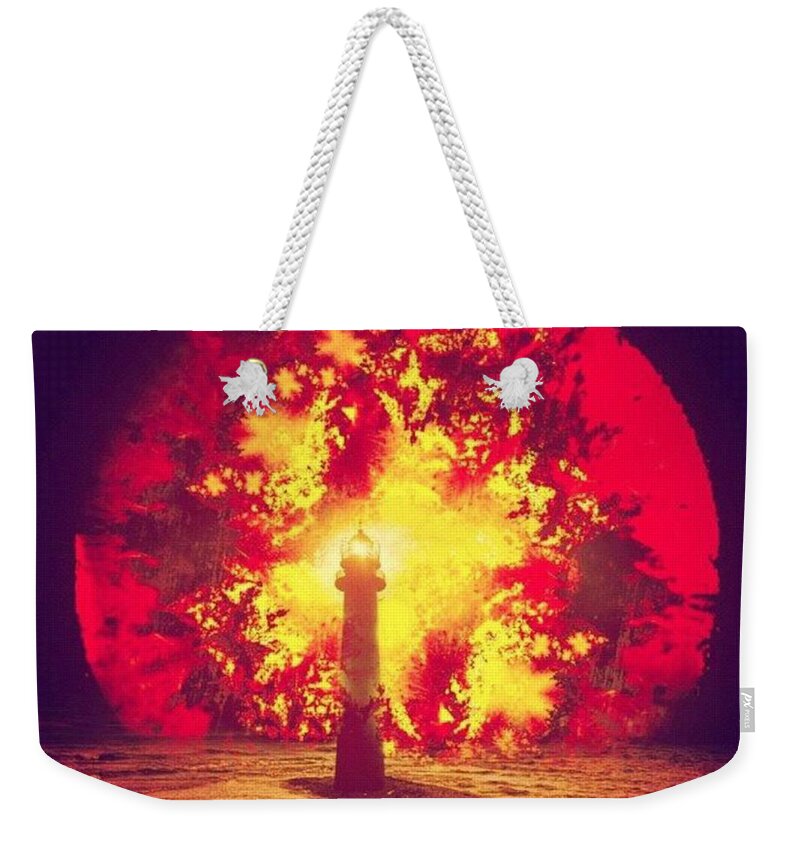 Multiedit Weekender Tote Bag featuring the photograph By the Light of the Fiery Trinity by Nick Heap