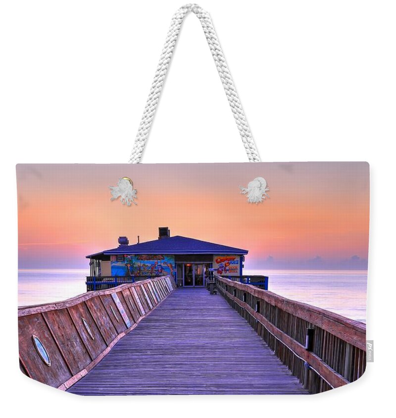 Crabby Joe's Sunglow Pier Weekender Tote Bag featuring the photograph Cabby Joe's Sunglow Pier by Carol Montoya