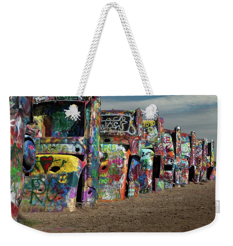 2016 Weekender Tote Bag featuring the photograph Cadillac Ranch by Tim Stanley