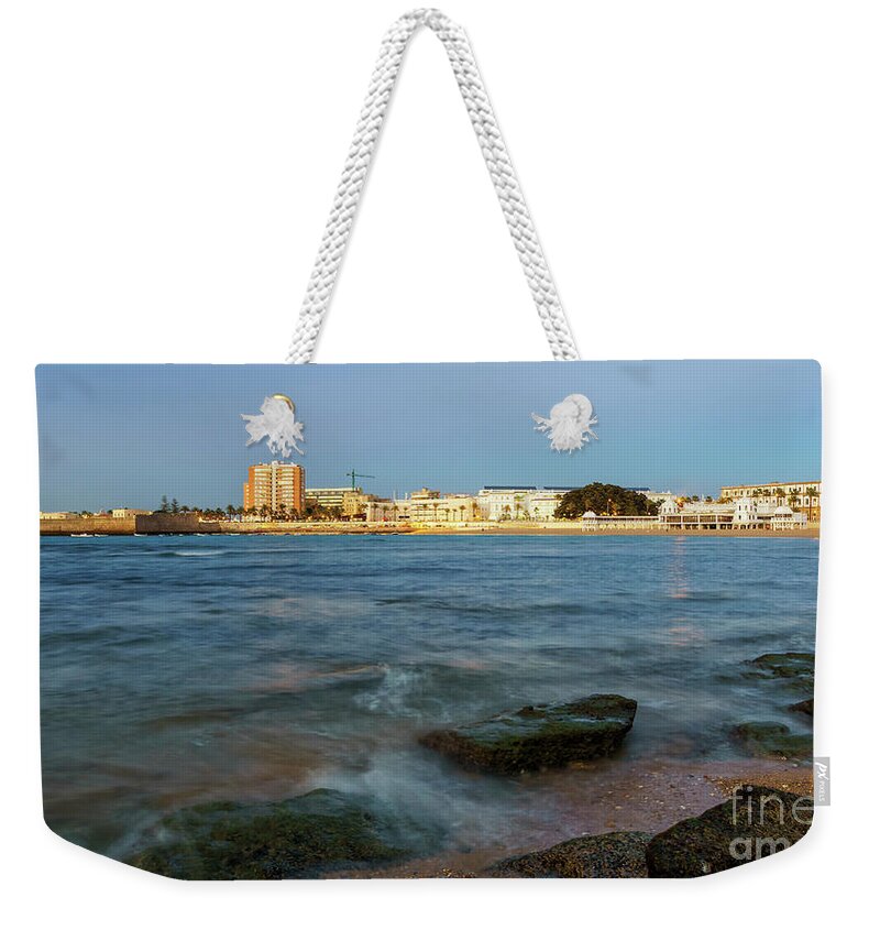 Coast Weekender Tote Bag featuring the photograph Caleta Beach and Spa Cadiz Spain by Pablo Avanzini
