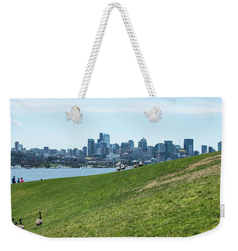 Canada Geese And Seattle Skyline Weekender Tote Bag featuring the photograph Canada Geese and Seattle Skyline by Tom Cochran