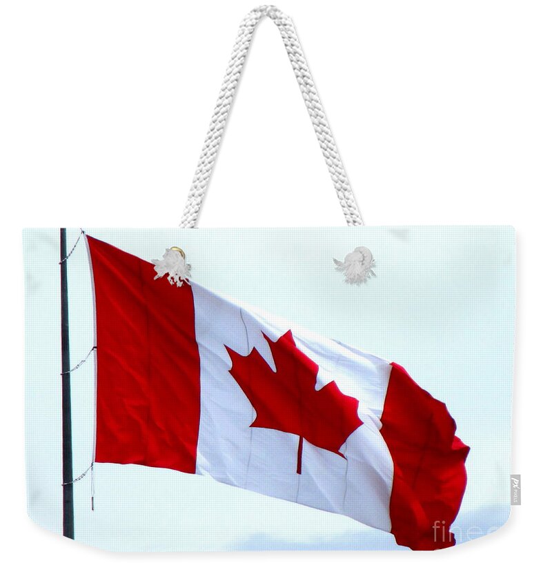 Canada Weekender Tote Bag featuring the photograph Canadian Flag by Randall Weidner