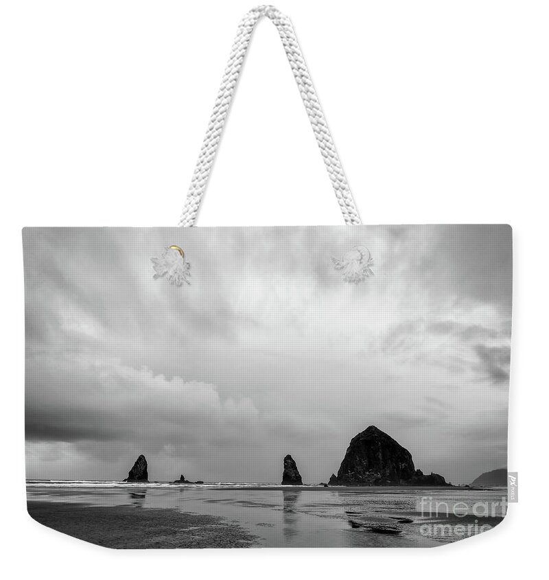 B&w Weekender Tote Bag featuring the photograph Cannon Beach in black and white by Paul Quinn