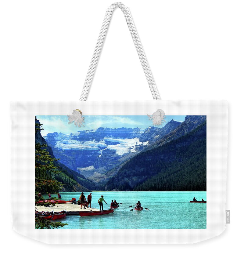 Lake Louise Weekender Tote Bag featuring the photograph Canoe Season on Lake Louise by Ola Allen
