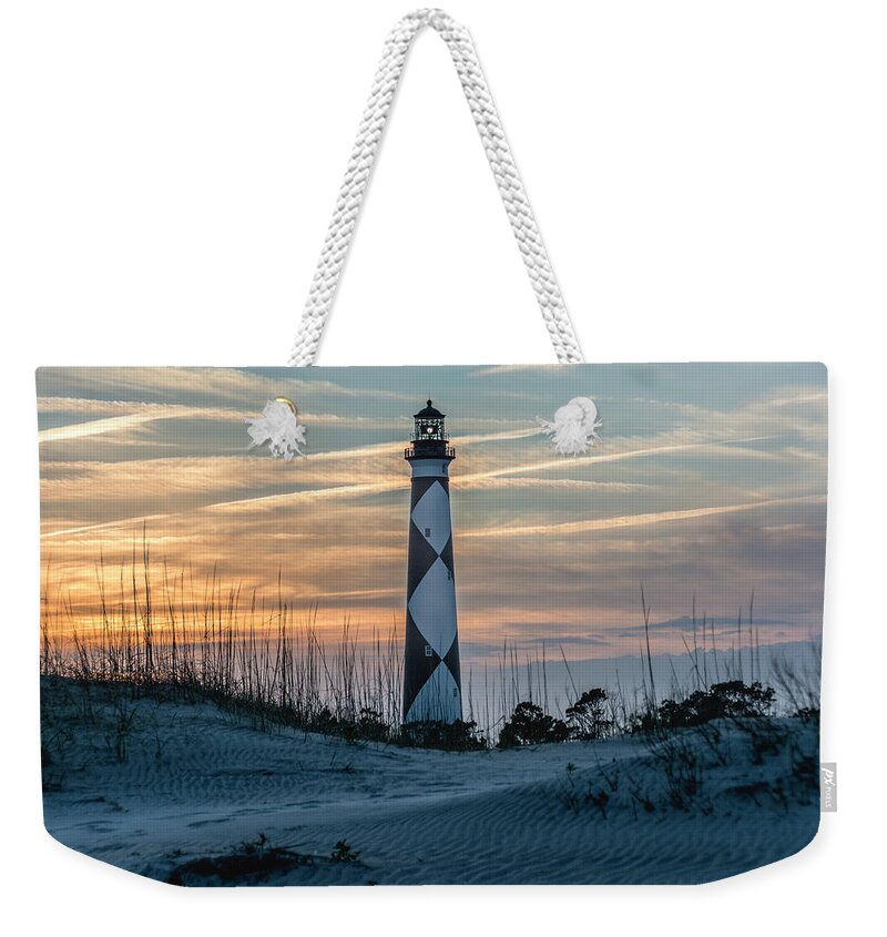 Cape Lookout Lighthouse Weekender Tote Bag featuring the photograph Cape Lookout Lighthouse at sunset by WAZgriffin Digital
