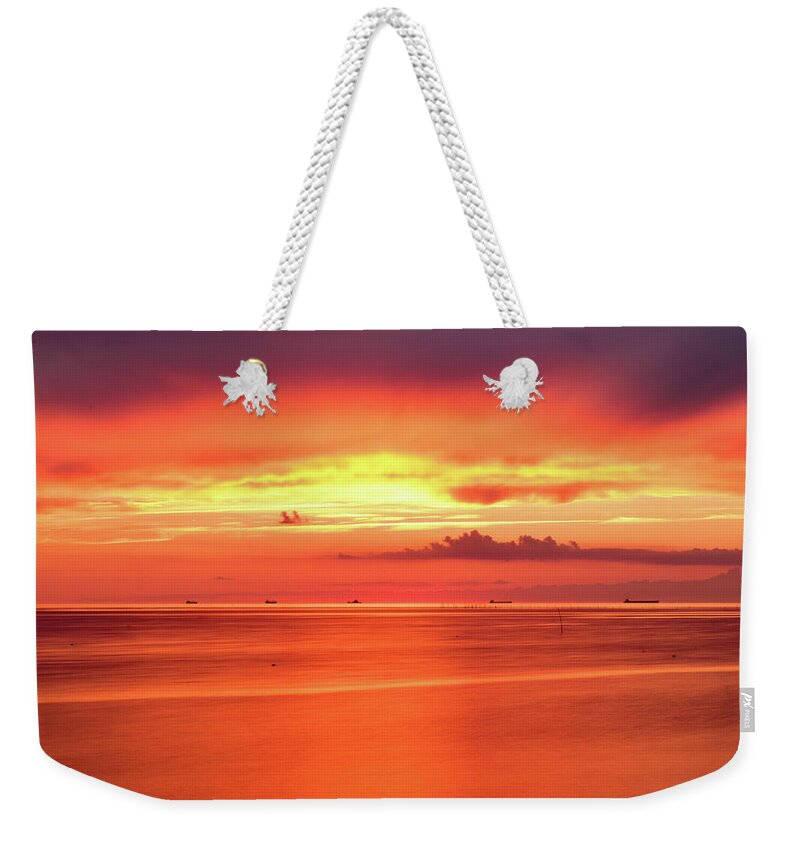 Sunset Weekender Tote Bag featuring the photograph Cargo Line by Nicole Lloyd