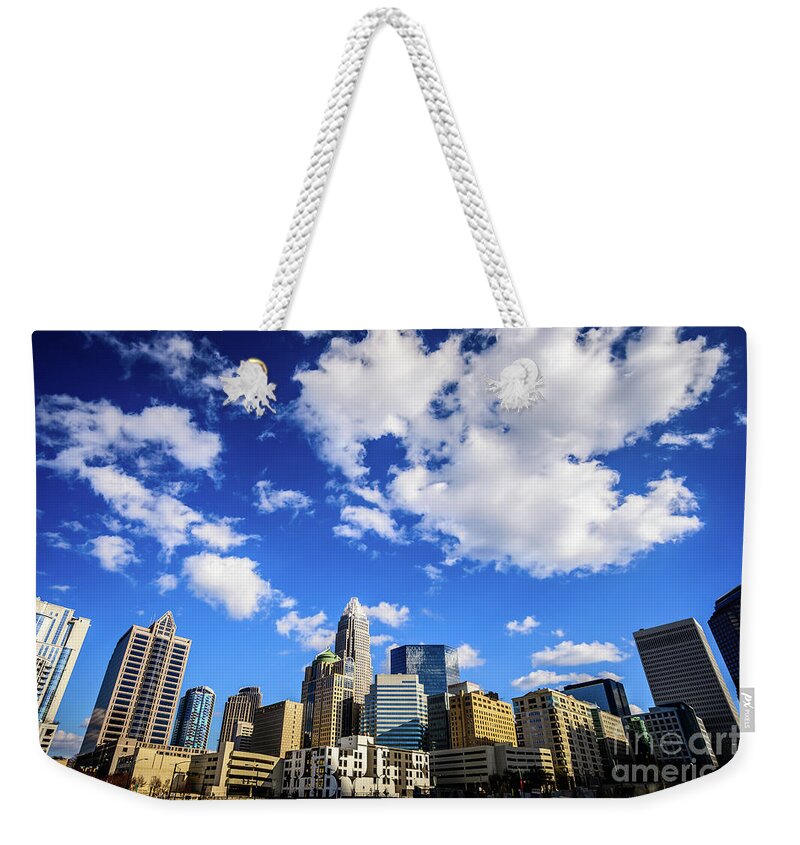 121 West Trade Weekender Tote Bag featuring the photograph Charlotte Skyline Blue Sky and Clouds by Paul Velgos