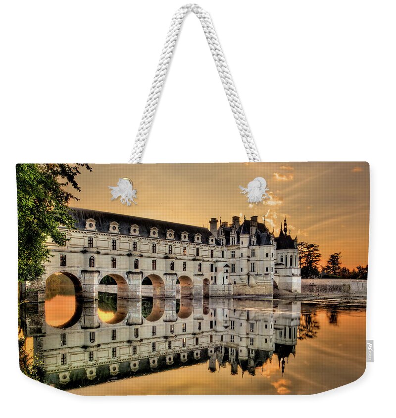 Chateau De Chenonceau Weekender Tote Bag featuring the photograph Chenonceau Castle in the twilight by Weston Westmoreland