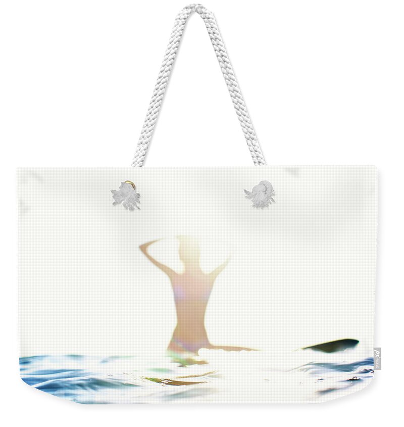 Surfing Weekender Tote Bag featuring the photograph Chica Agua by Nik West
