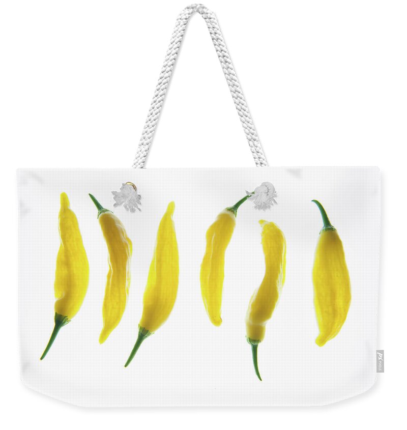 Chilies Weekender Tote Bag featuring the photograph Chillies Lined Up ii by Helen Jackson