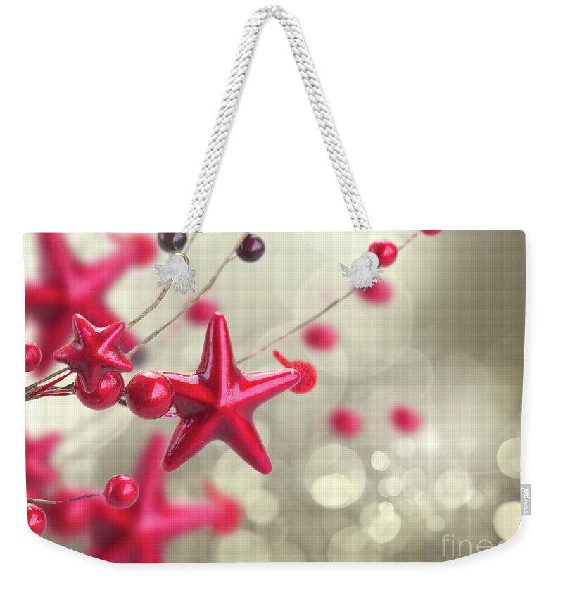 Christmas Weekender Tote Bag featuring the photograph Christmas Stars and Berries by Anastasy Yarmolovich