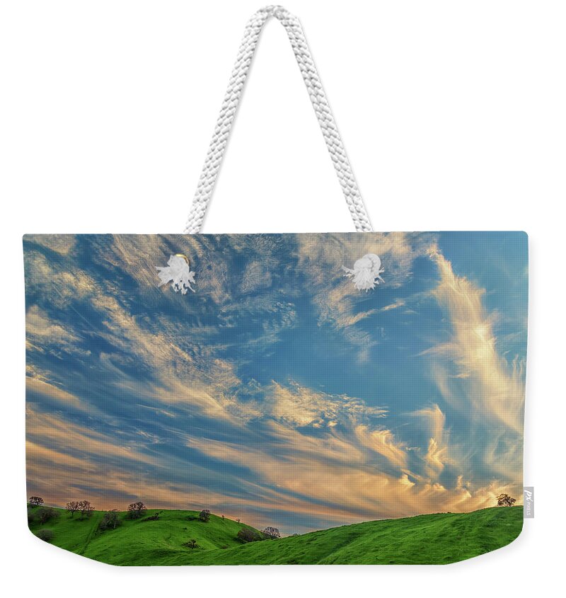 Landscape Weekender Tote Bag featuring the photograph Cirrus Couds Over Green Hills by Marc Crumpler