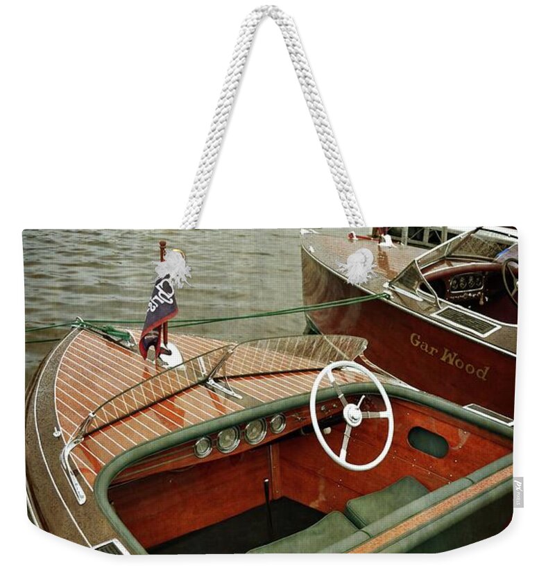 Steering Wheel Weekender Tote Bag featuring the photograph Classic Boats Docked on a Cloudy Day by Michelle Calkins