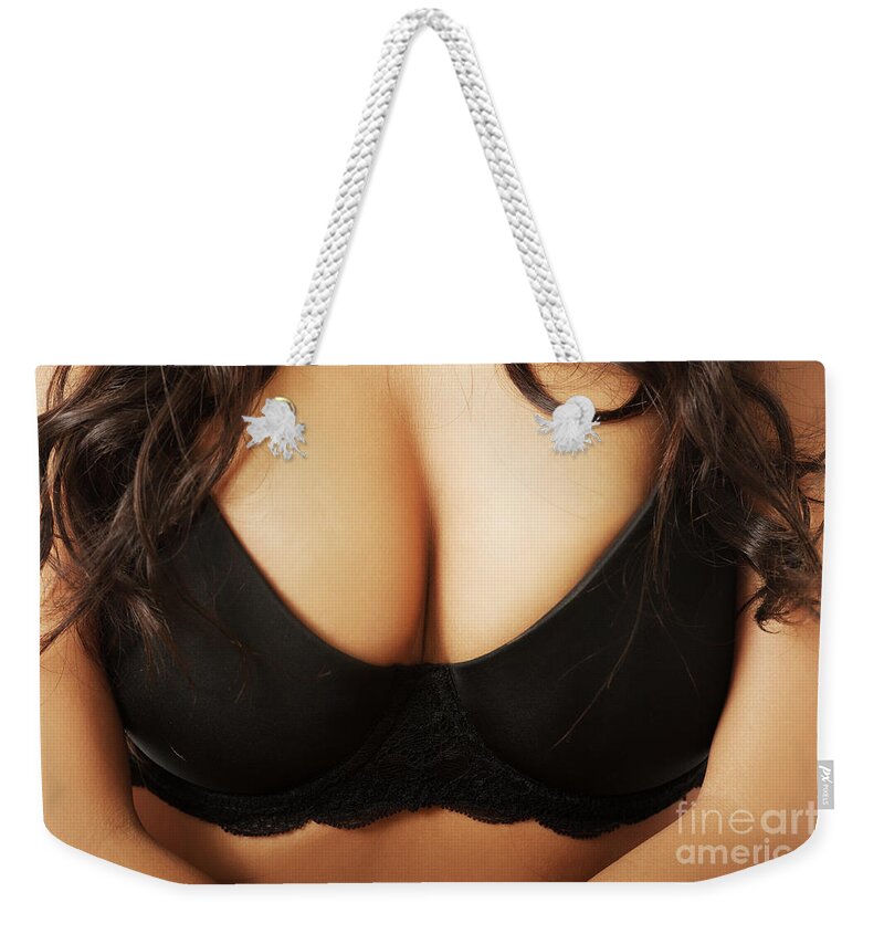 Close up on female boobs in black bra Weekender Tote Bag by Piotr