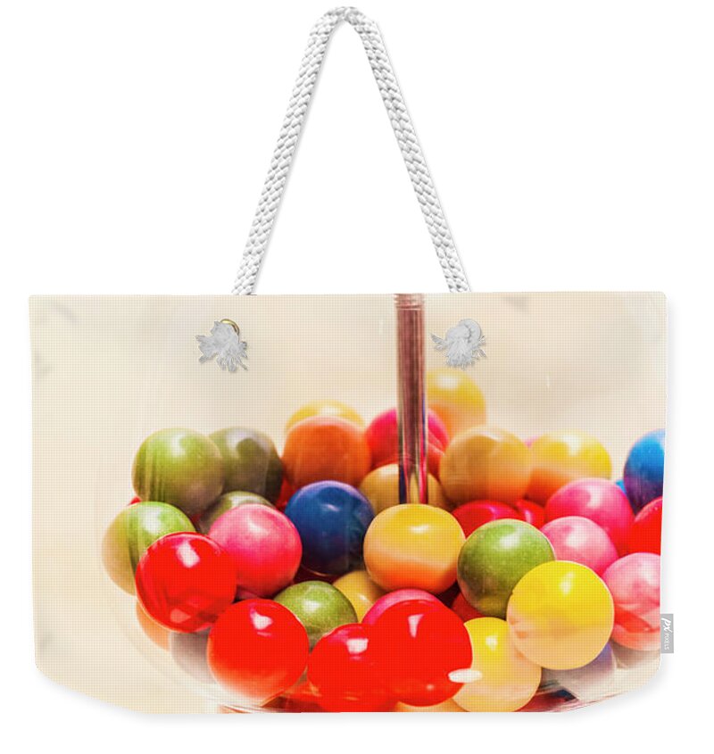 Lollies Weekender Tote Bag featuring the photograph Closeup Of Colorful Gumballs In Candy Dispenser by Jorgo Photography