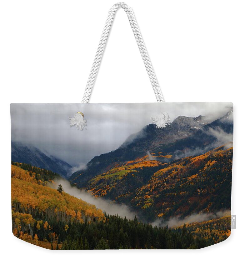 Autumn Weekender Tote Bag featuring the photograph Clouds and fog encompass autumn at McClure Pass in Colorado by Jetson Nguyen