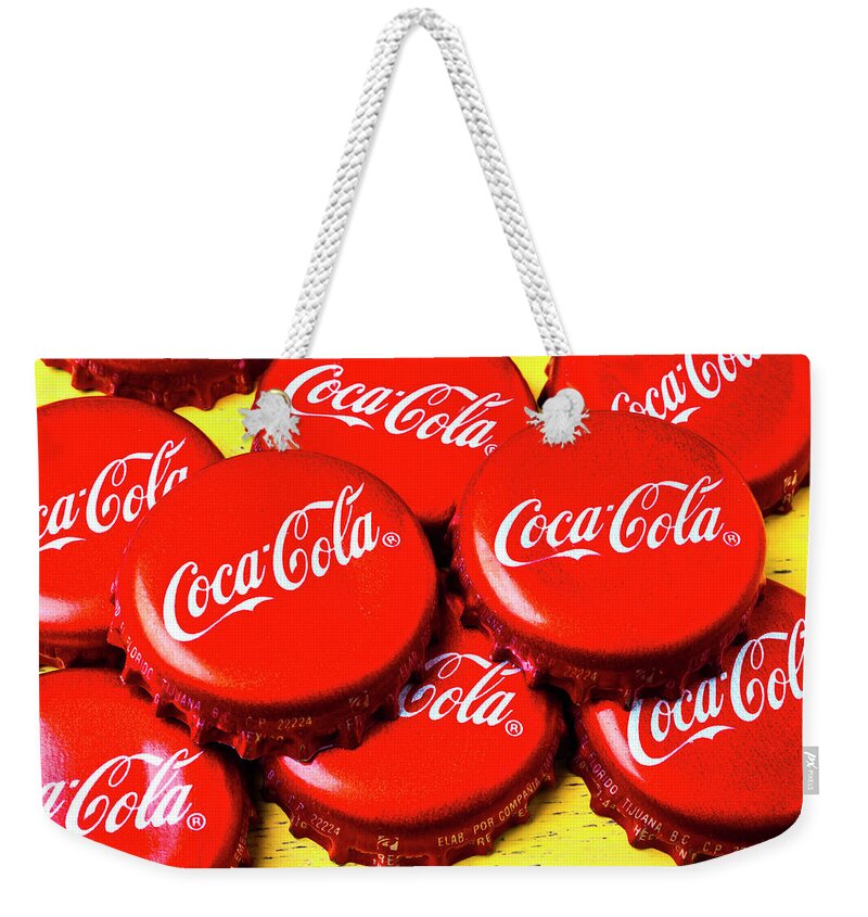 Coca Cola Weekender Tote Bag featuring the photograph Coca Cola Caps by Garry Gay