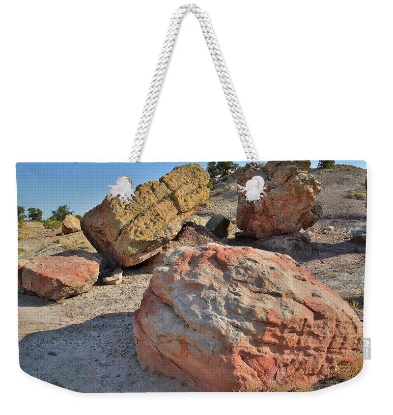 Grand Junction Weekender Tote Bag featuring the photograph Colorful Boulders in the Bentonite Site on Little Park Road by Ray Mathis