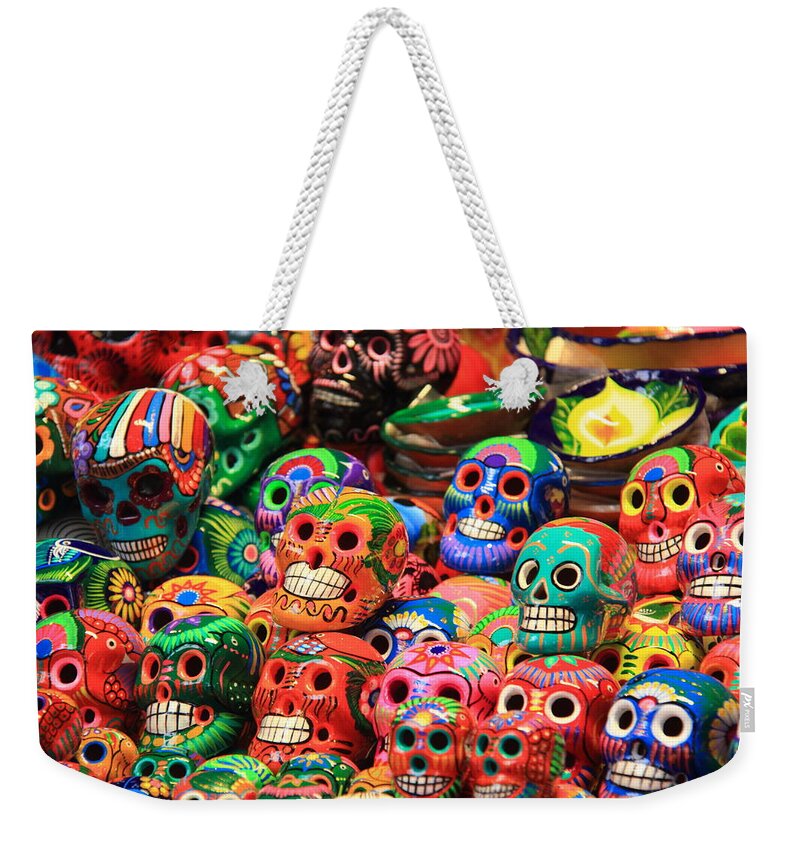 Skulls Weekender Tote Bag featuring the photograph Colorful Mexican Day of the Dean Ceramic Skulls by Roupen Baker