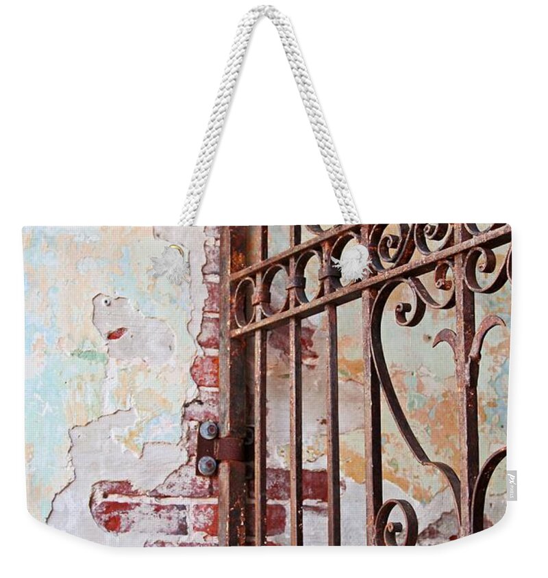 Gate Weekender Tote Bag featuring the photograph Consequences of the Past by Michiale Schneider