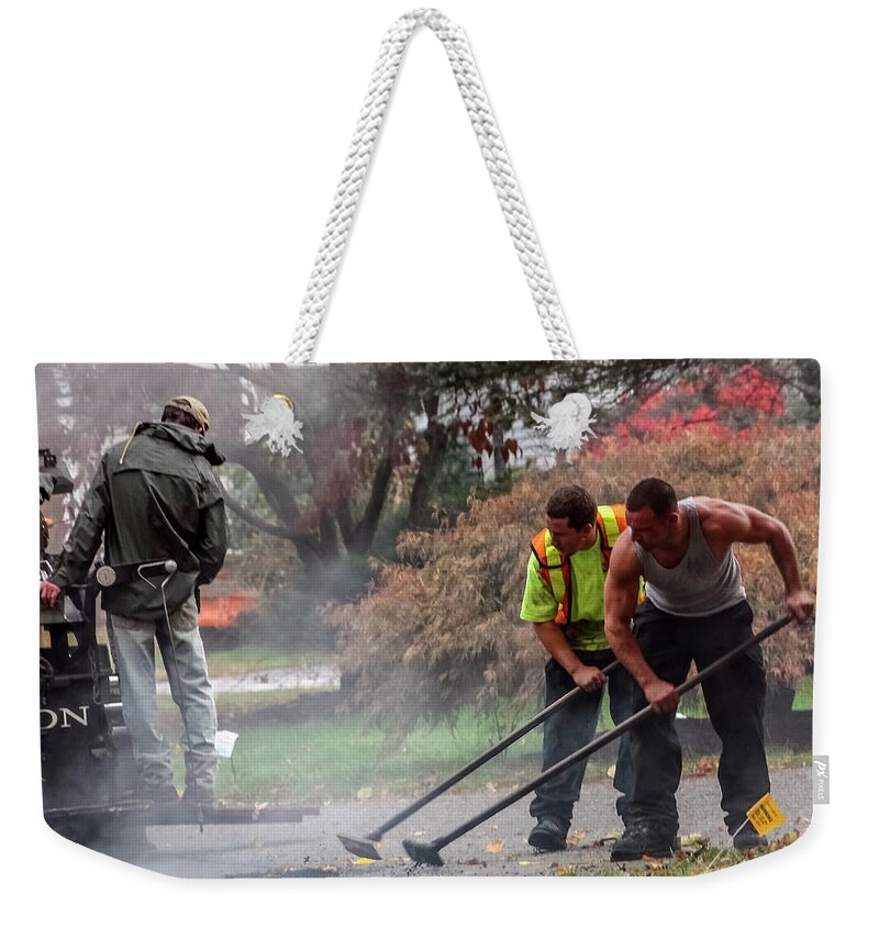 Construction Weekender Tote Bag featuring the photograph Young Male Construction Workers at Work Paving Road by Betty Denise