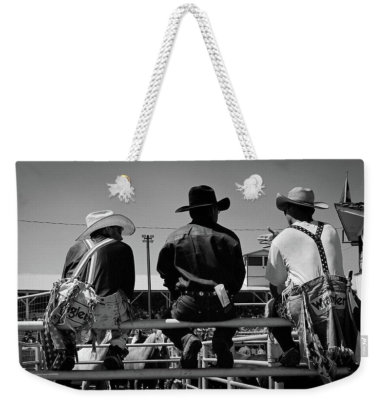 Cowboy Weekender Tote Bag featuring the photograph Corral Talk by John Andy Herrera