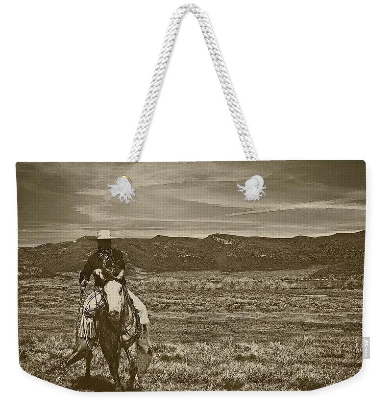 Sepia Weekender Tote Bag featuring the photograph Cowboy Ride by Amanda Smith