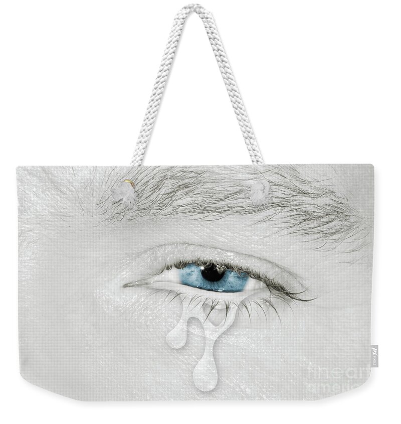 Left Weekender Tote Bag featuring the photograph Crying blue left eye by Benny Marty