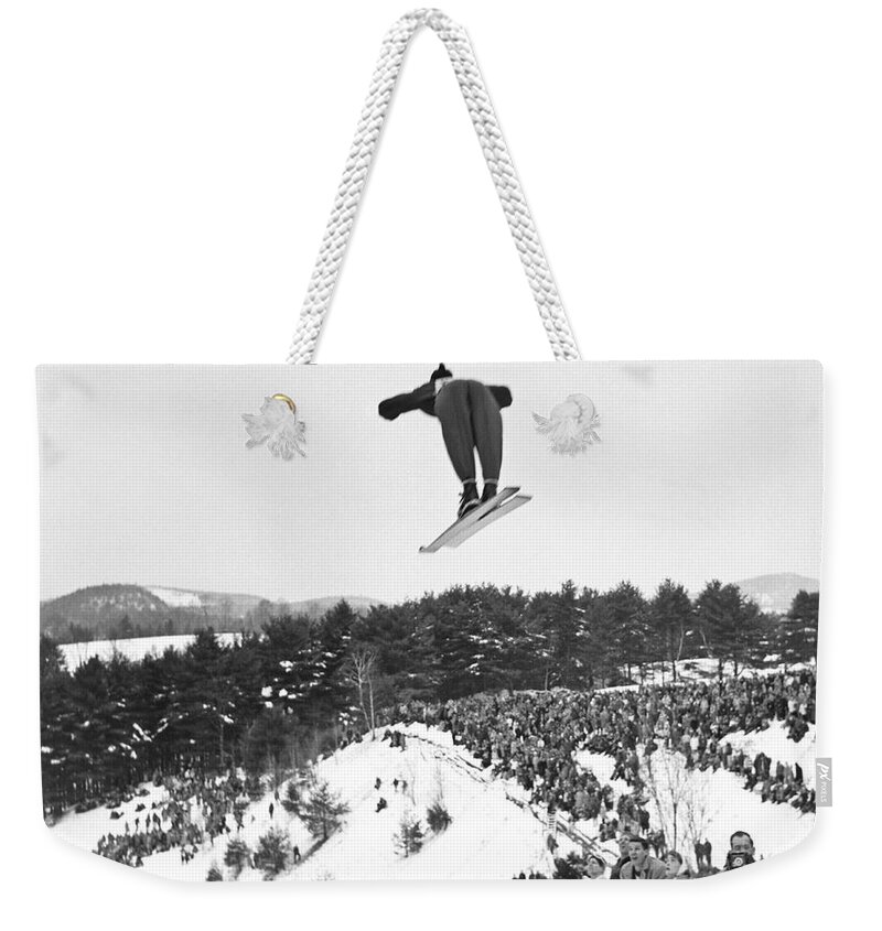 1950's Weekender Tote Bag featuring the photograph Dartmouth Carnival Ski Jumper by Underwood Archives