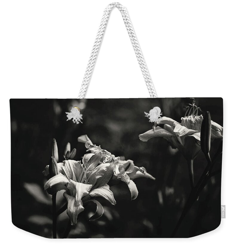 Daylilies Weekender Tote Bag featuring the photograph Daylilies in black and white by Toni Hopper