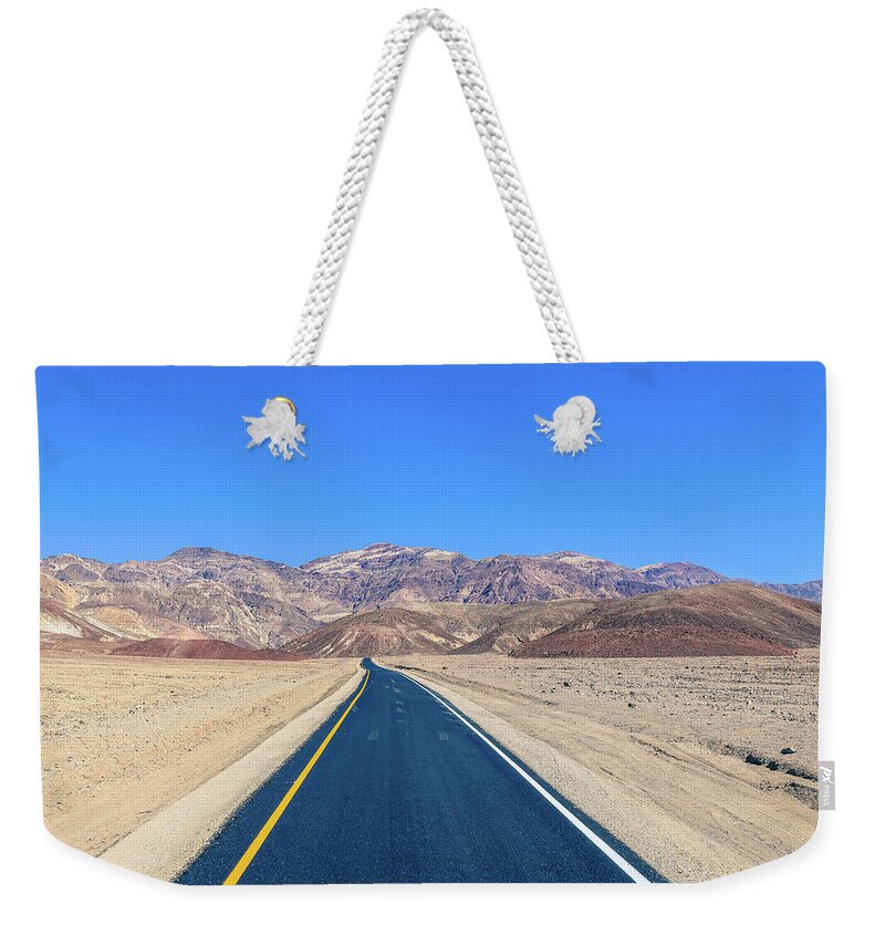 Usa Weekender Tote Bag featuring the photograph Death Valley road by Alberto Zanoni