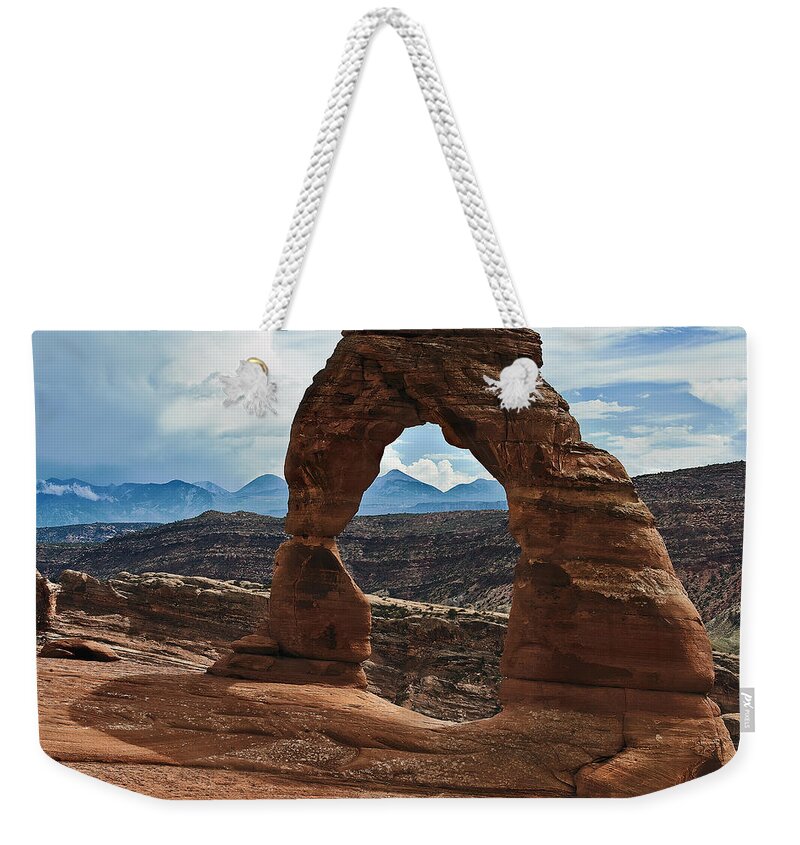 Desert Weekender Tote Bag featuring the photograph Delicate Arch by John Christopher