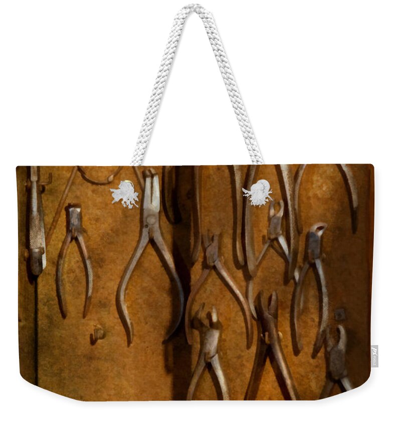 Dentist Weekender Tote Bag featuring the photograph Dentist - Methods of extraction by Mike Savad