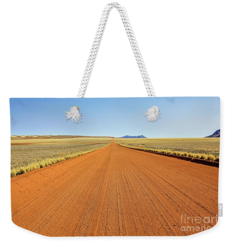 African Weekender Tote Bag featuring the photograph Desert road by Benny Marty