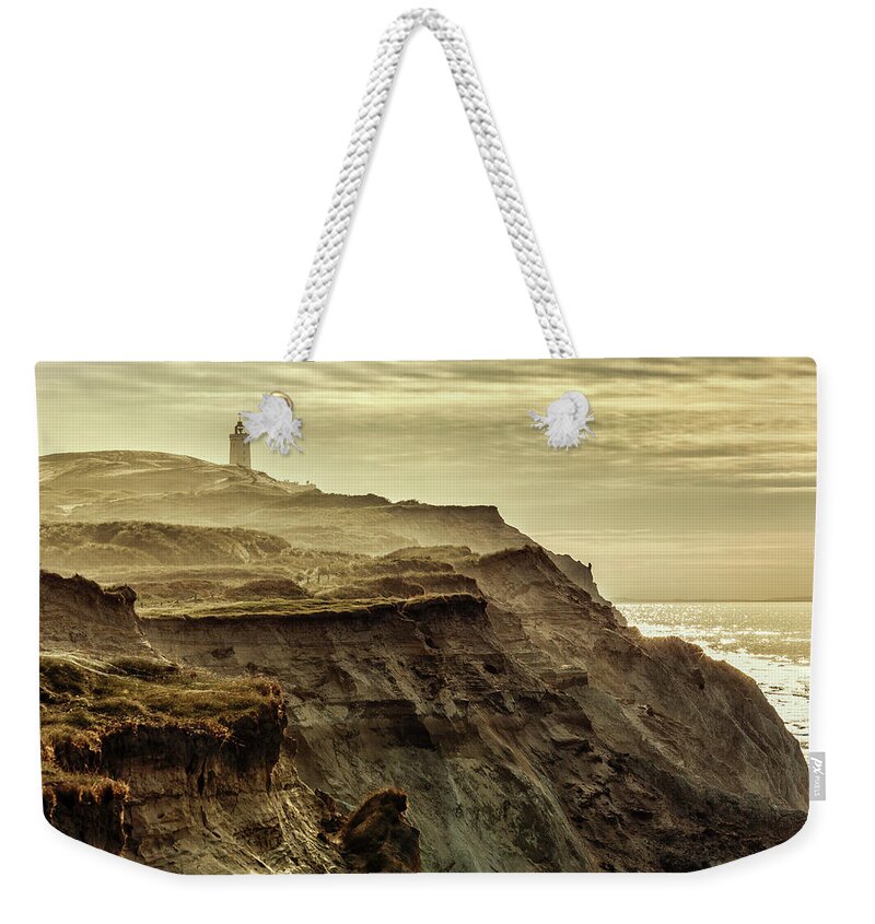 Sand Weekender Tote Bag featuring the photograph Distant lighthouse by Mike Santis