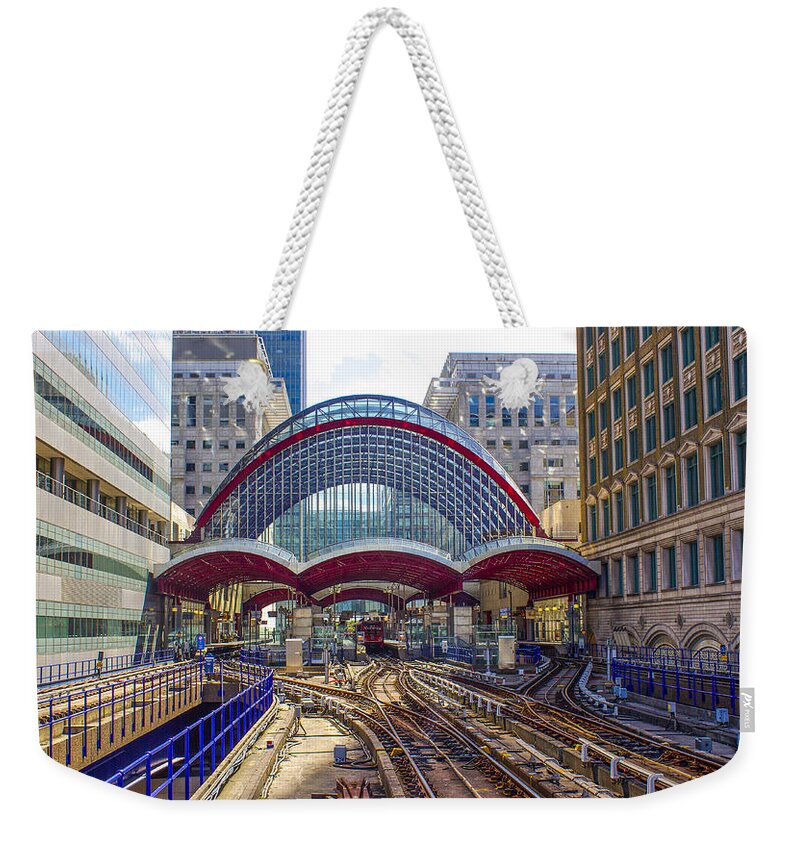 Railway Weekender Tote Bag featuring the photograph DLR Canary Wharf and Approaching Train by Venetia Featherstone-Witty