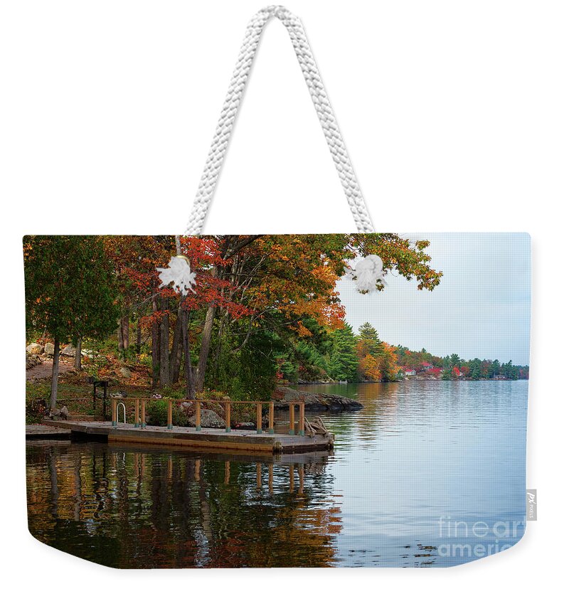 Lake Weekender Tote Bag featuring the photograph Dock on lake in fall by Les Palenik