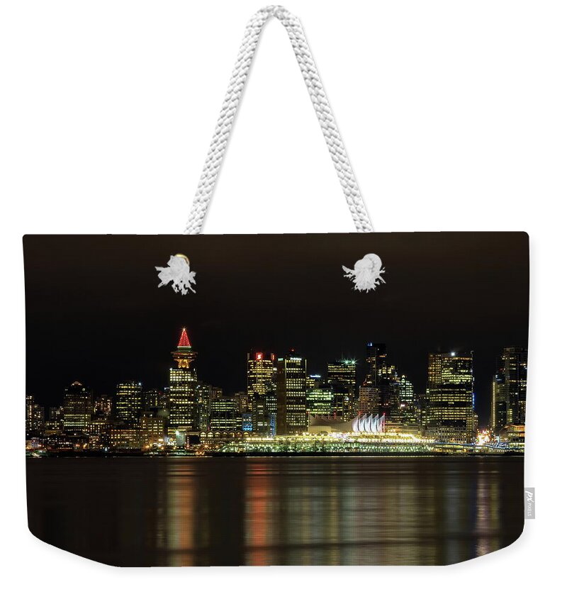 Alex Lyubar Weekender Tote Bag featuring the photograph Downtown of Vancouver City night time by Alex Lyubar