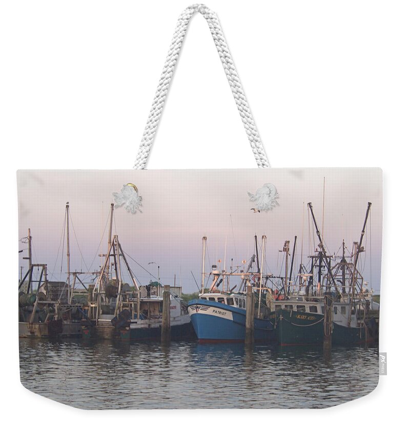 Dragger Weekender Tote Bag featuring the photograph Dragger by Newwwman