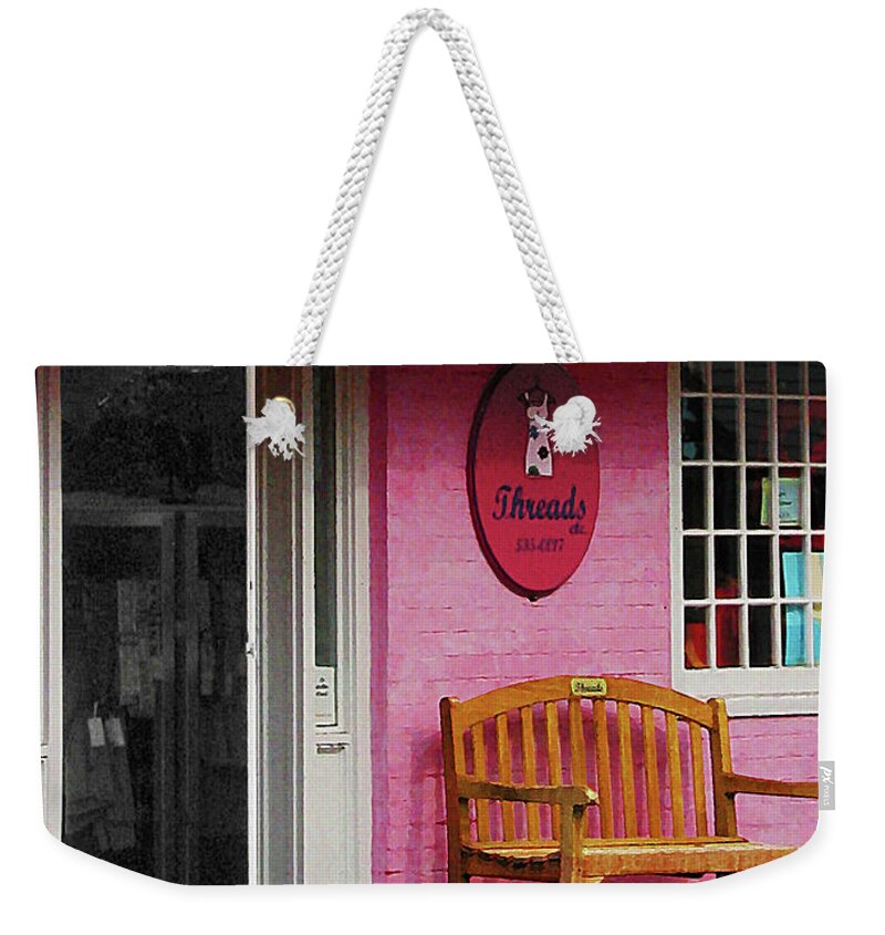 Awning Weekender Tote Bag featuring the photograph Dress Shop with Orange and Blue Awning by Susan Savad